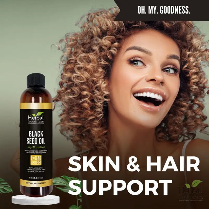 A dark amber glass bottle of black seed oil with gold-accented label in herbal oil bundle for immune support